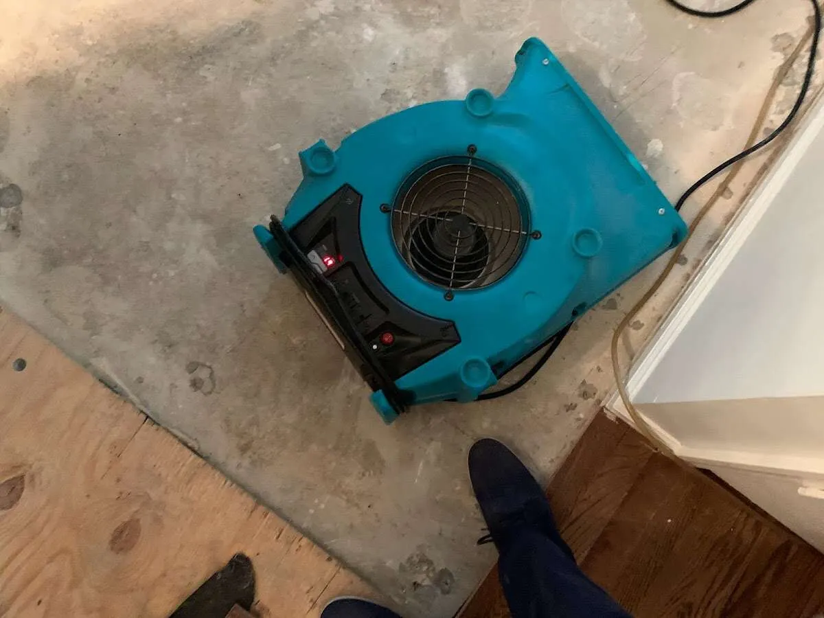 Air mover drying subfloor during Leak Detection & Repair in Montgomery